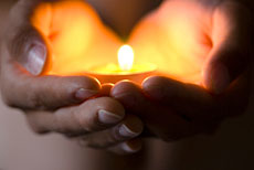 230_hands_candle